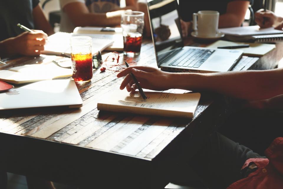 A desk with laptops during a working day