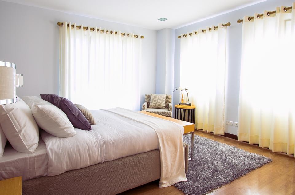 An unmade bed in a quiet room